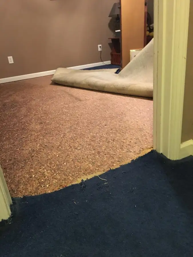 Carpet pad removal revealing water damage during Drying & Dehumidification in Bixby